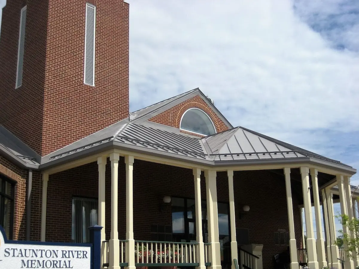 Skilled roofing craftsmen working on a residential roof in Somersville